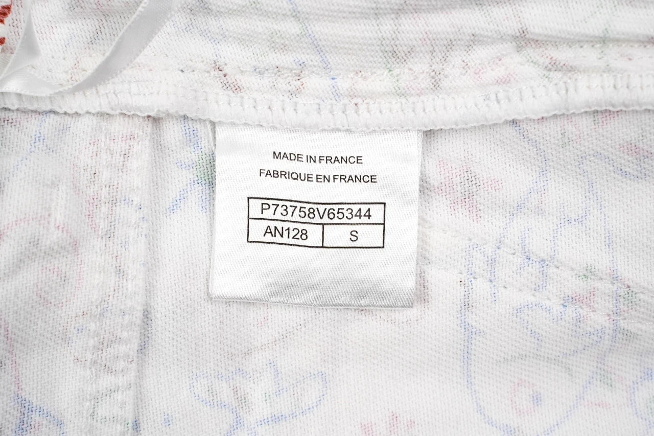 CHANEL Cream White Graffiti Straight-Leg Jeans product photo from LabelPicks