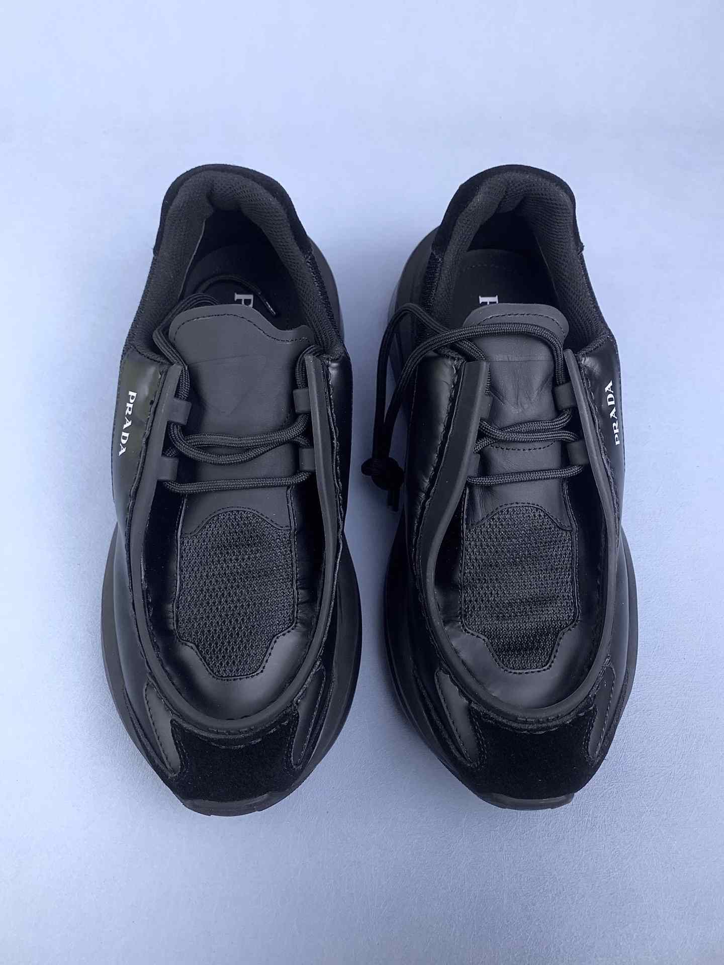 Systeme leather and Re-Nylon slip-on sneakers