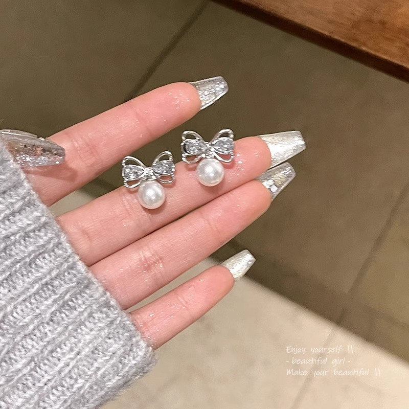 S925 sterling silver butterfly knot pearl earrings, women's summer Korean-style minimalist luxury design with delicate cubic zirconia accents