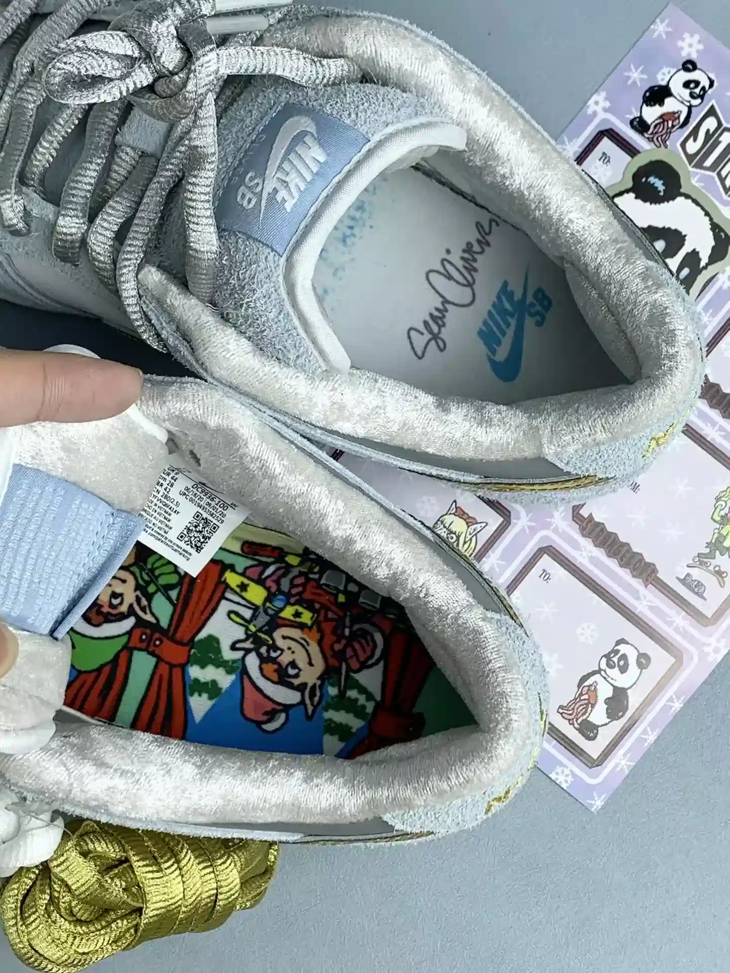 Sean Cliver x Nike SB Dunk Low Pro QS “Holiday Special” - White/Psychic Blue/Metallic Gold product photo from LabelPicks