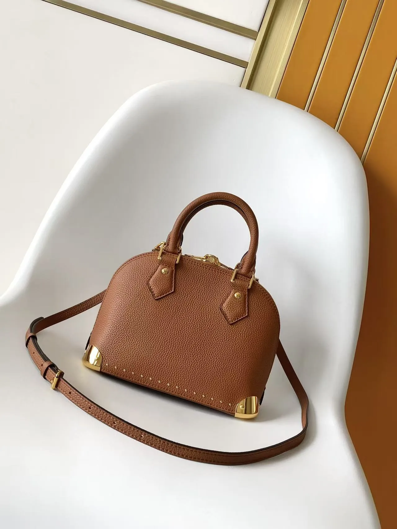 Louis Vuitton Alma Canvas and Leather Top Handle Bag product photo from LabelPicks
