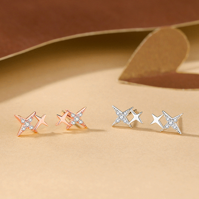 Sparkling cubic zirconia stud earrings, 925 sterling silver cross starburst earrings, minimalist and delicate geometric earrings in a cool, understated style
