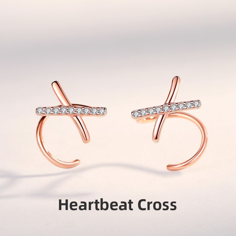 French-style minimalist cross earrings for women, featuring diamond accents, a unique and elegant design, and delicate cubic zirconia stones in a small X-shape