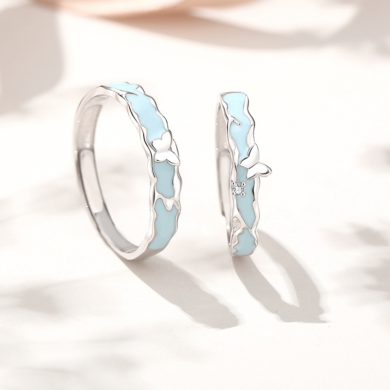 Original design, a pair of butterfly-themed rings for couples, made of 925 sterling silver, featuring a minimalist and unique style, with enamel and resin accents, and a luminous effect in the dark