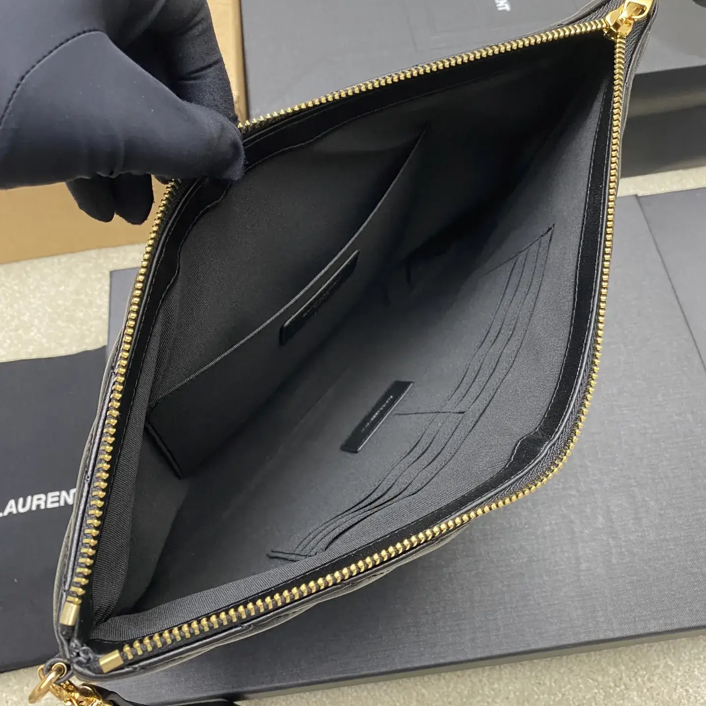 Saint Laurent Quilted Leather Clutch product photo from LabelPicks
