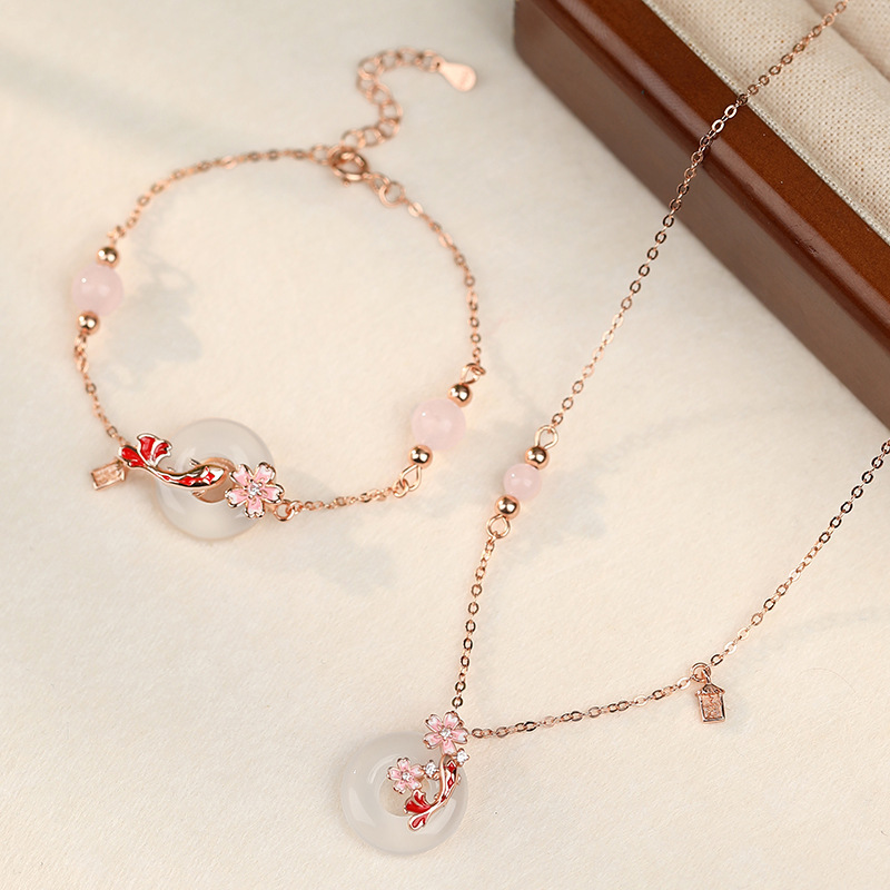 Original design: Peace knot and koi fish bracelet for women, made of 925 sterling silver, featuring a new Chinese-style floral design with white jade and crystal beads