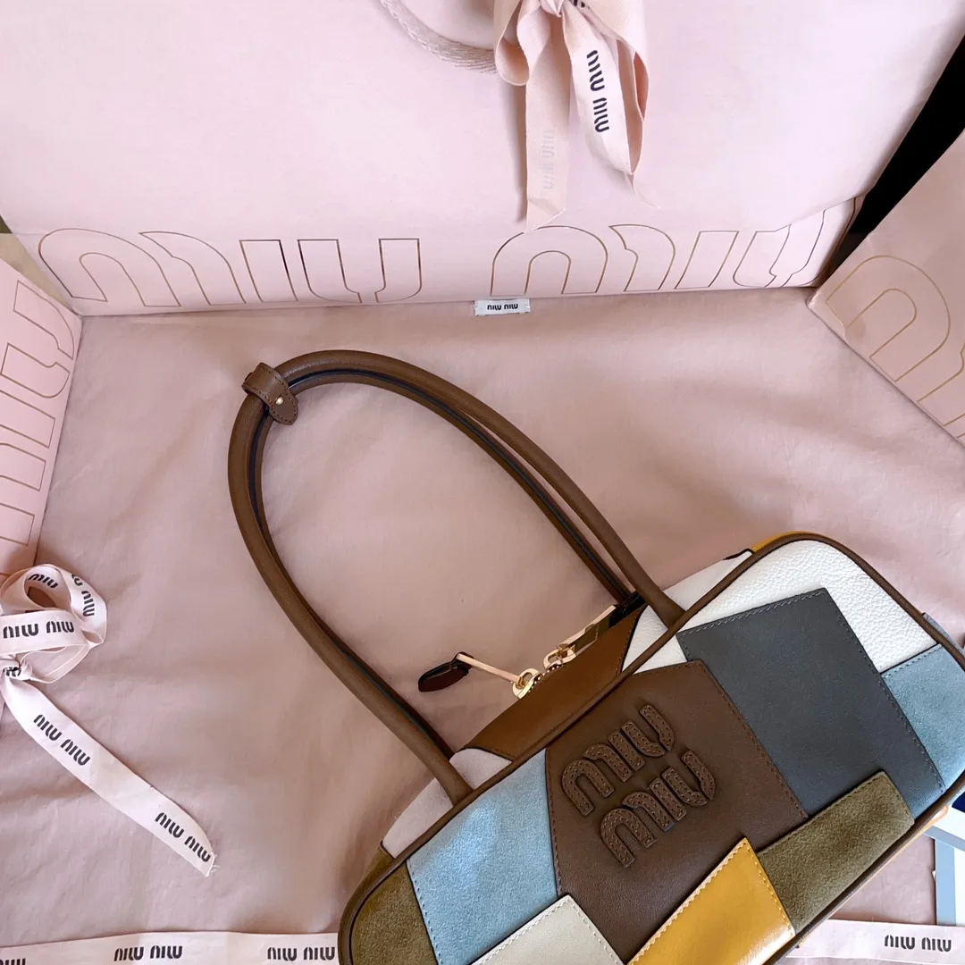 Miu Miu Canvas and Leather Top Handle Bag product photo from LabelPicks