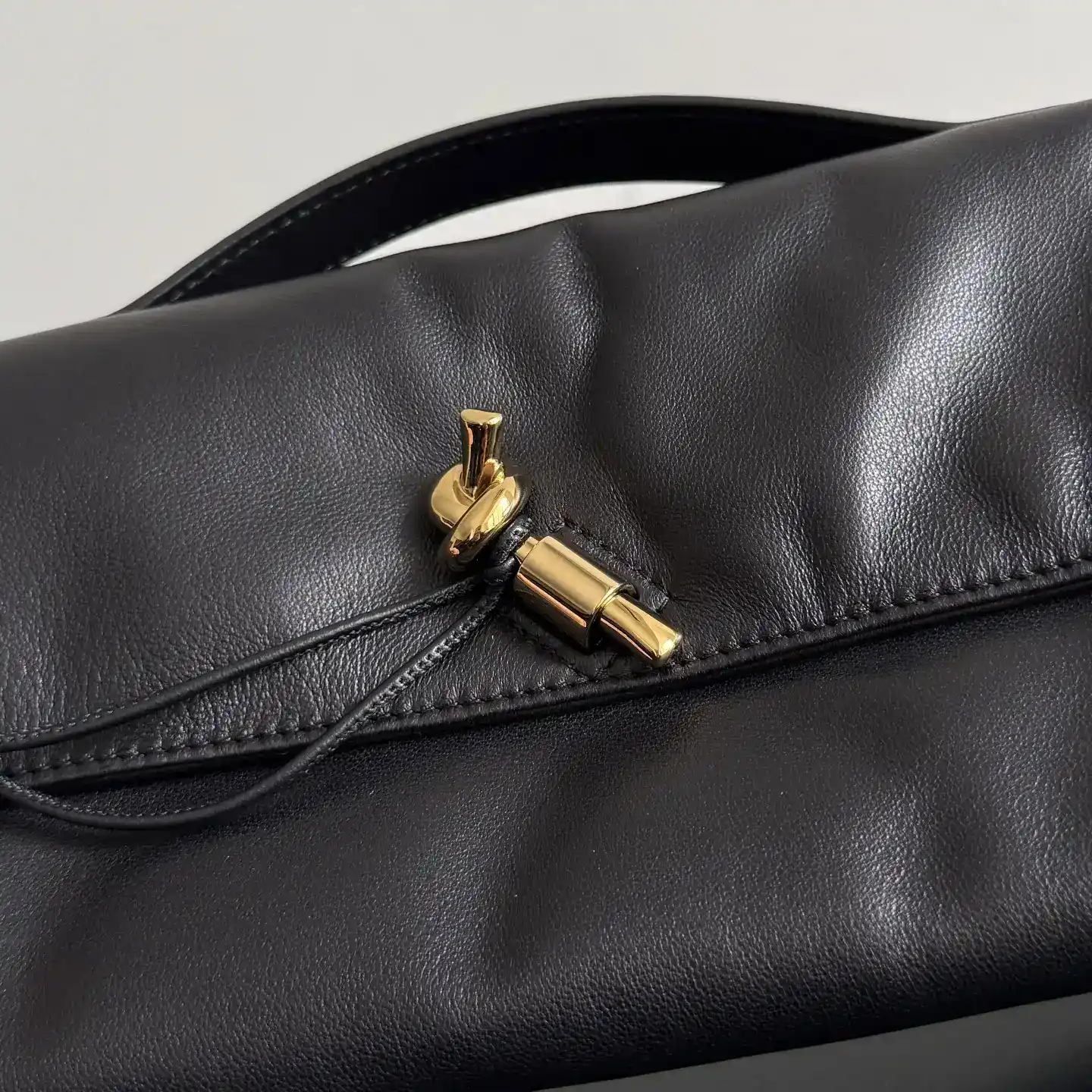 Bottega Veneta Andiamo Intrecciato Woven Leather Clutch product photo from LabelPicks