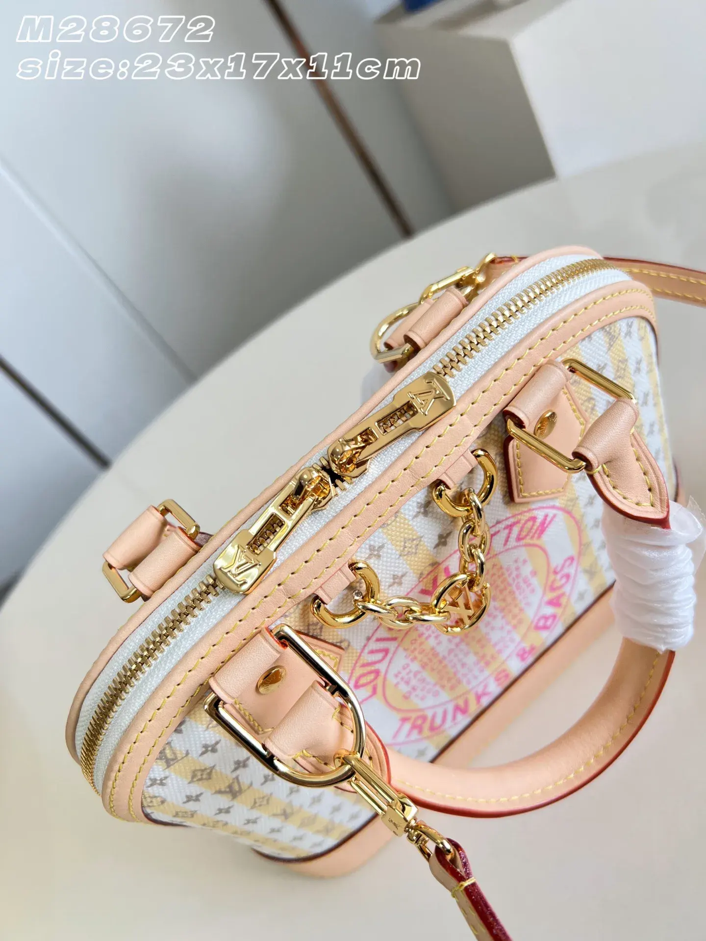 Louis Vuitton Alma Gold Canvas and Leather Top Handle Bag product photo from LabelPicks