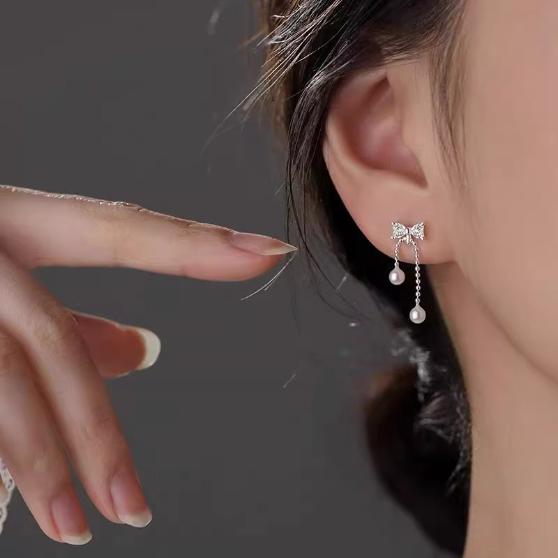 925 sterling silver bow-tie tassel pearl earrings, featuring a delicate and fresh design with cubic zirconia stones, creating a sophisticated and elegant look