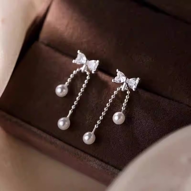 925 sterling silver bow-tie tassel pearl earrings, featuring a delicate and fresh design with cubic zirconia stones, creating a sophisticated and elegant look