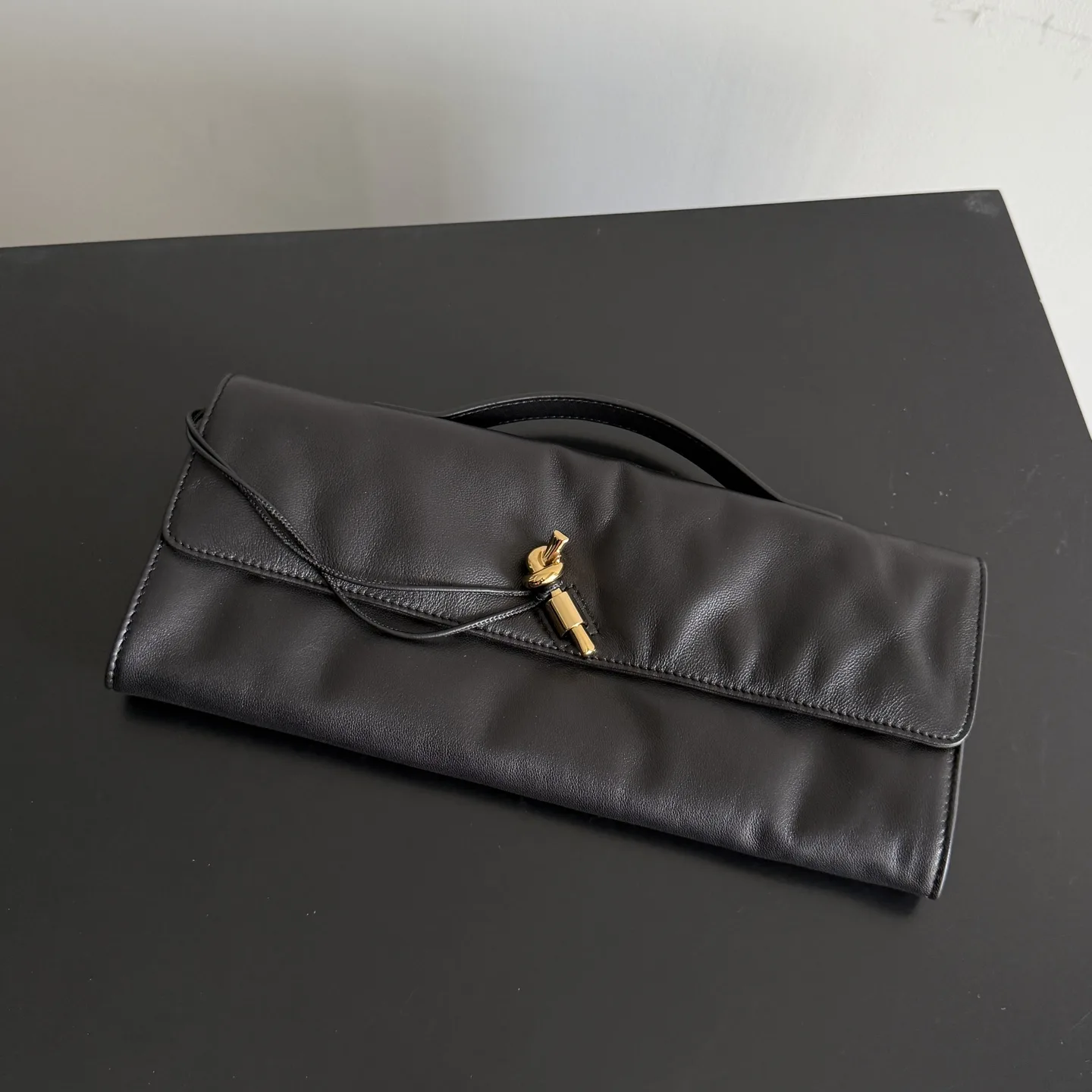 Bottega Veneta Andiamo Intrecciato Woven Leather Clutch product photo from LabelPicks