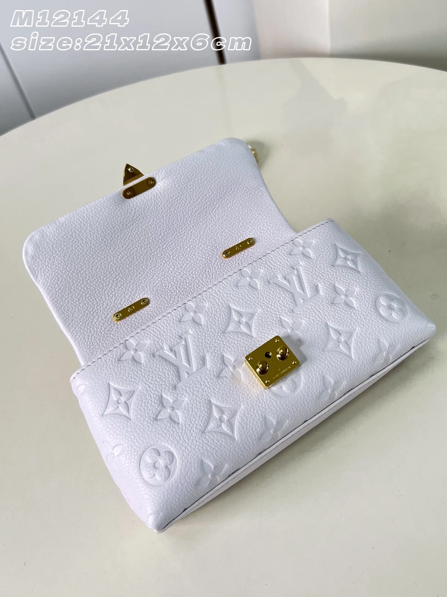 Louis Vuitton Madeleine Woven Leather Top Handle Bag product photo from LabelPicks
