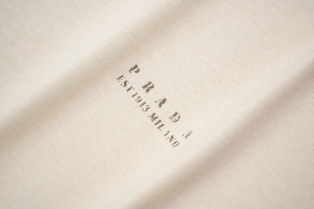 Prada Off-White Distressed Small Logo Triangle T-Shirt product photo from LabelPicks