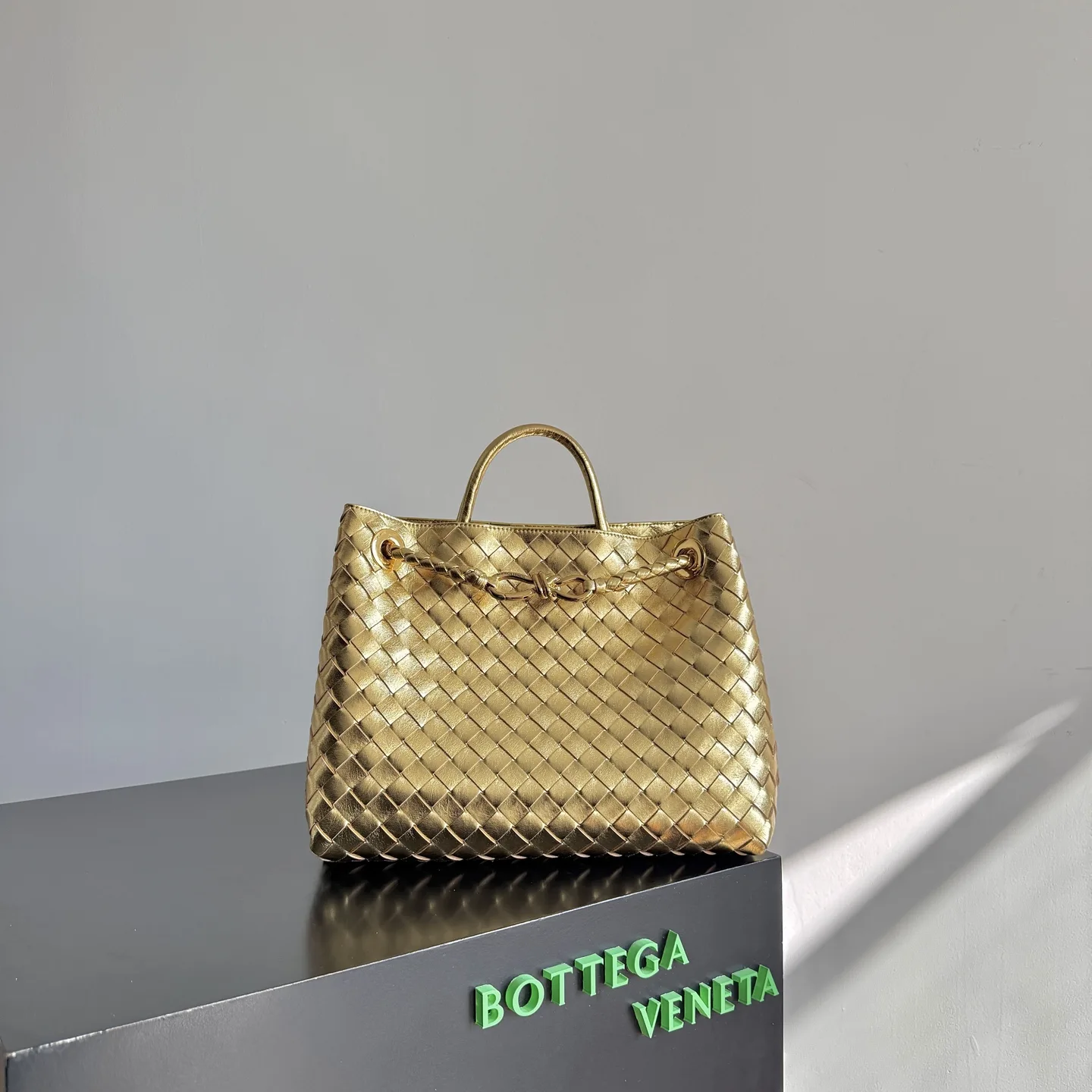 Bottega Veneta Gold Andiamo Intrecciato Woven Leather Top Handle Bag product photo from LabelPicks