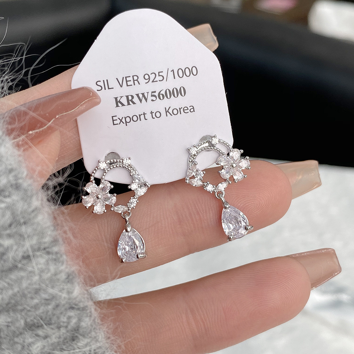 S925 sterling silver moonlit tea brewing earrings, featuring a hollow design, a cubic zirconia flower ring, and a delicate, stylish, and unique look