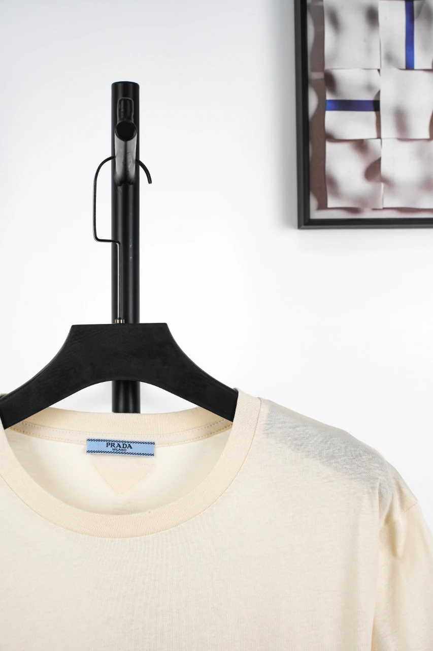 Prada Off-White Distressed Small Logo Triangle T-Shirt product photo from LabelPicks