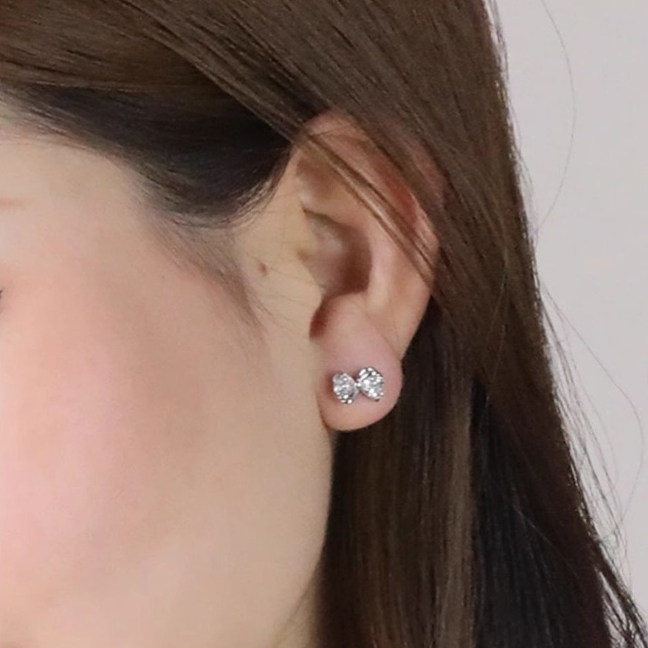 925 sterling silver heart-shaped, sparkling rhinestone butterfly knot earrings, Korean-style, delicate and fresh, perfect for young girls, with a unique and understated design
