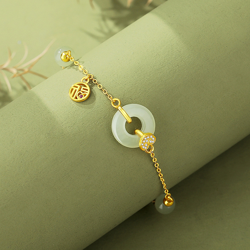 Original design, featuring a “Fu” character and a peace symbol, in a pure silver bracelet with a Chinese-style design, incorporating Hetian jade and 18K gold accents