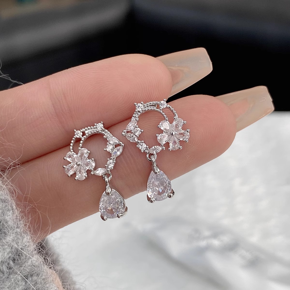 S925 sterling silver moonlit tea brewing earrings, featuring a hollow design, a cubic zirconia flower ring, and a delicate, stylish, and unique look