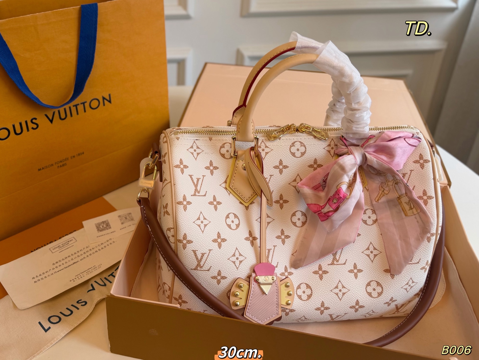 LV Dune-colored Speedy Boston bag