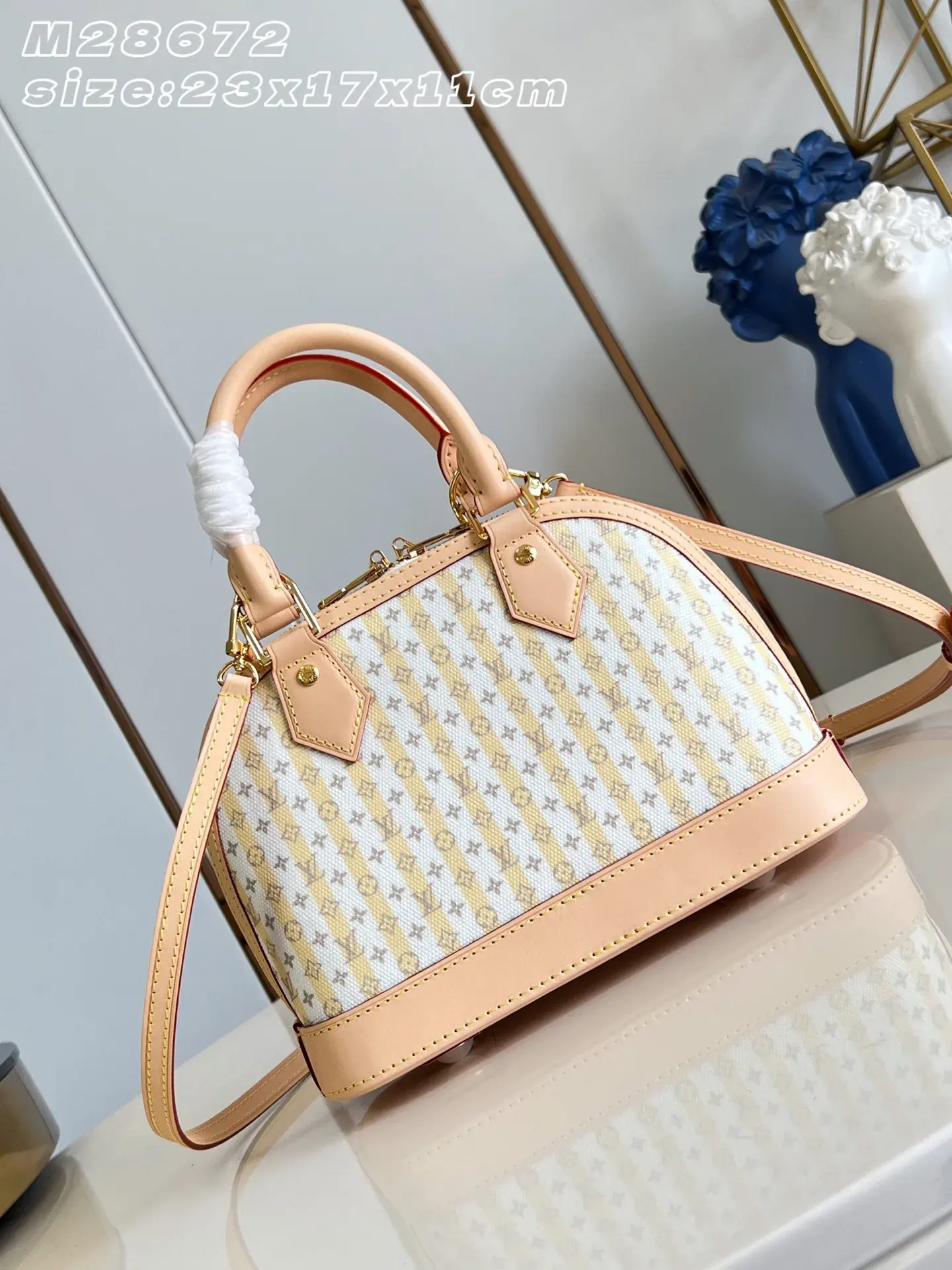 Louis Vuitton Alma Gold Canvas and Leather Top Handle Bag product photo from LabelPicks