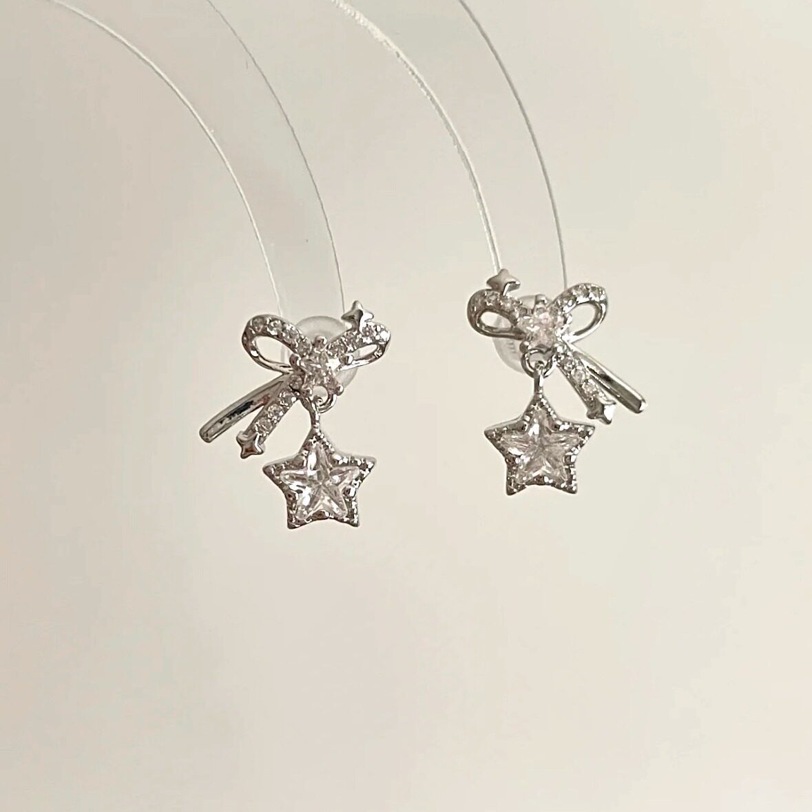 925 sterling silver star and bowknot earrings, cute and sweet, versatile, Korean-style, trendy, and with a unique, high-end aesthetic