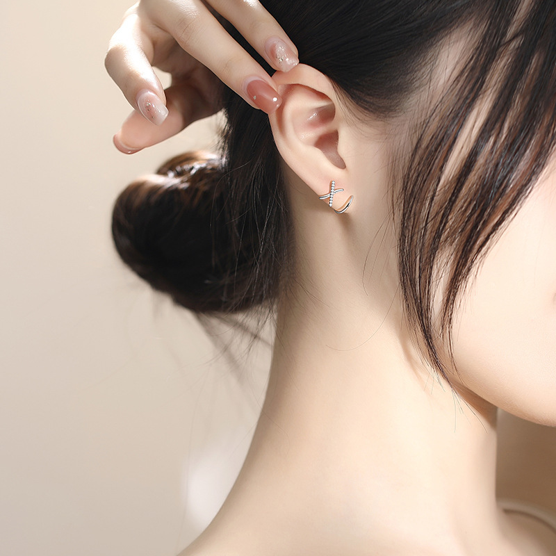 French-style minimalist cross earrings for women, featuring diamond accents, a unique and elegant design, and delicate cubic zirconia stones in a small X-shape