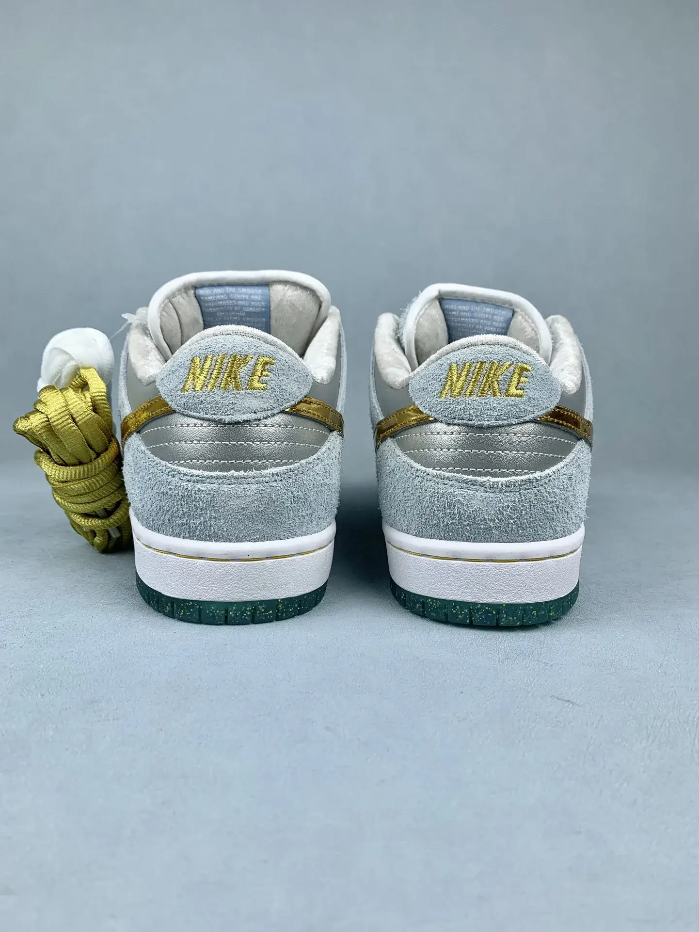 Sean Cliver x Nike SB Dunk Low Pro QS “Holiday Special” - White/Psychic Blue/Metallic Gold product photo from LabelPicks