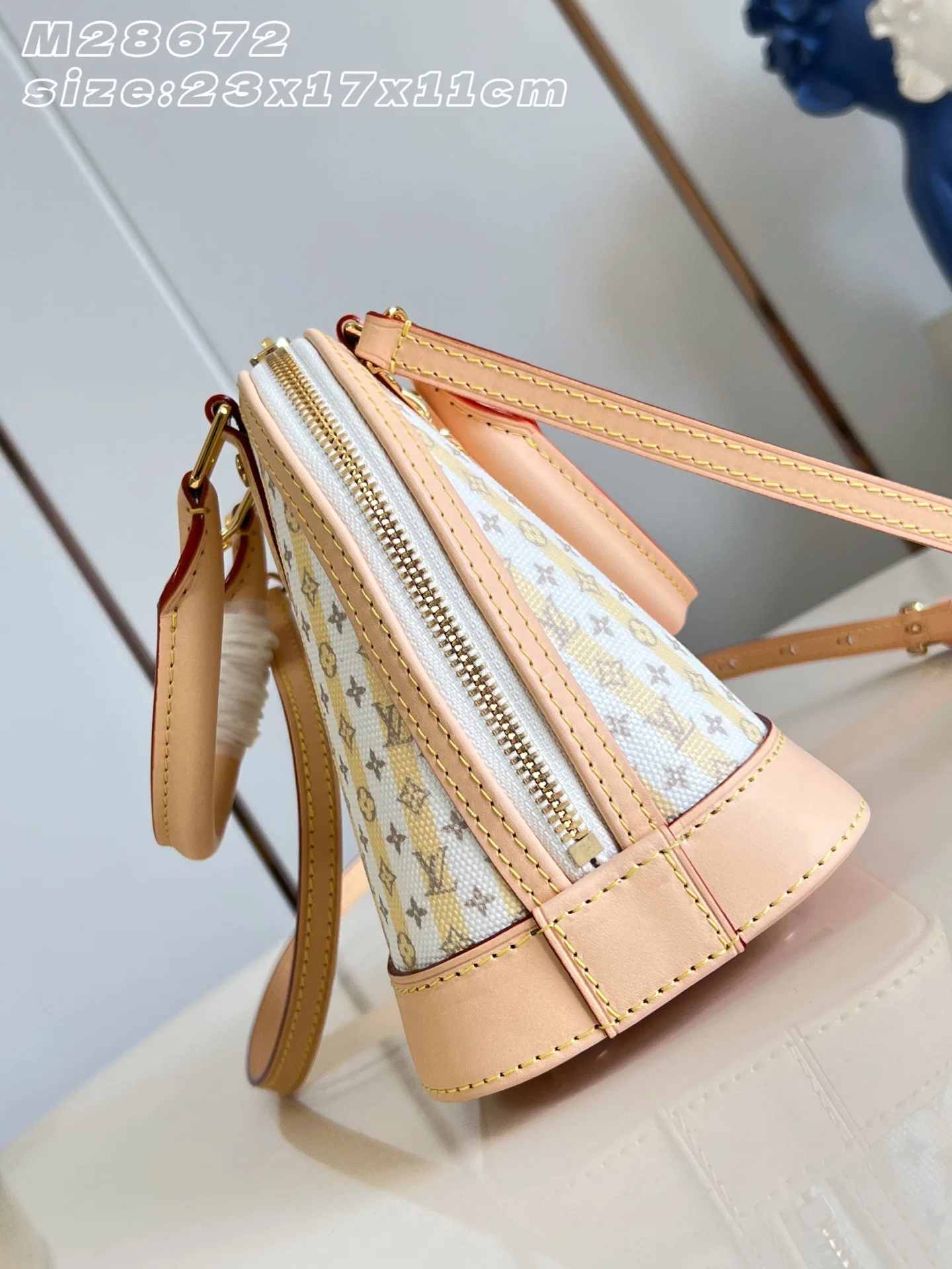 Louis Vuitton Alma Gold Canvas and Leather Top Handle Bag product photo from LabelPicks