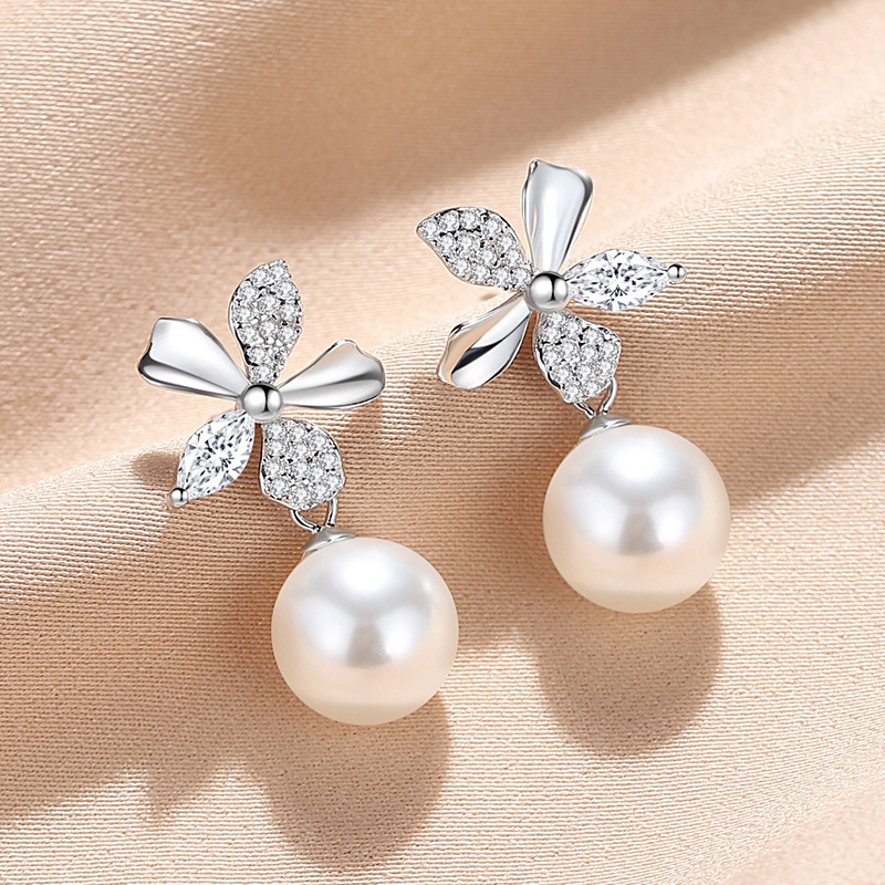 S925 sterling silver five-petal flower shell pearl earrings, a unique and stylish floral design for women, exuding elegance and sophistication