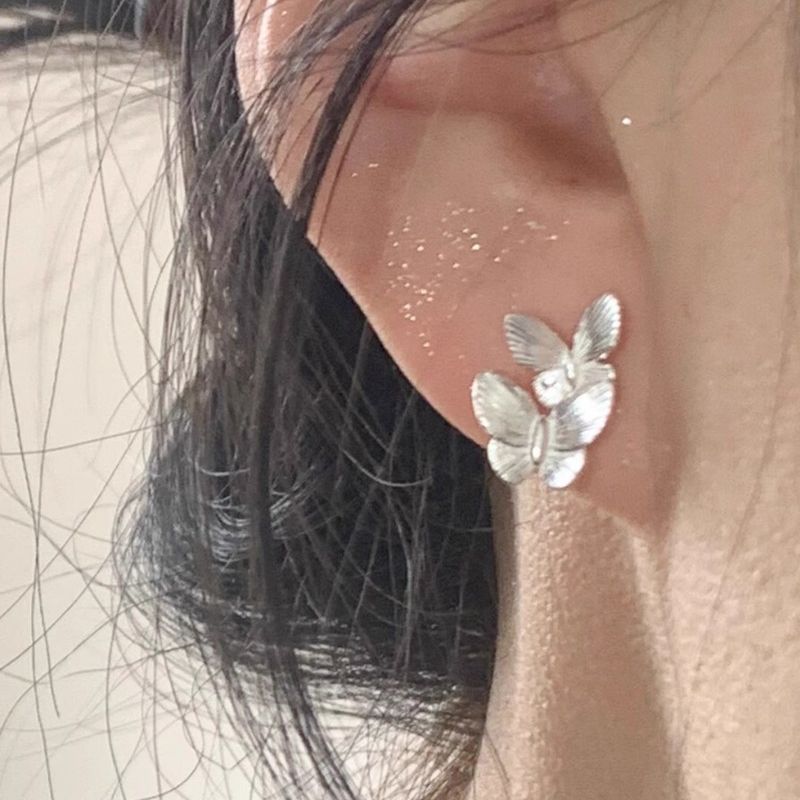 999 pure silver butterfly earrings, a trendy Korean-style accessory for women, perfect for summer, featuring a minimalist and fresh design, and a delicate, Instagram-worthy aesthetic