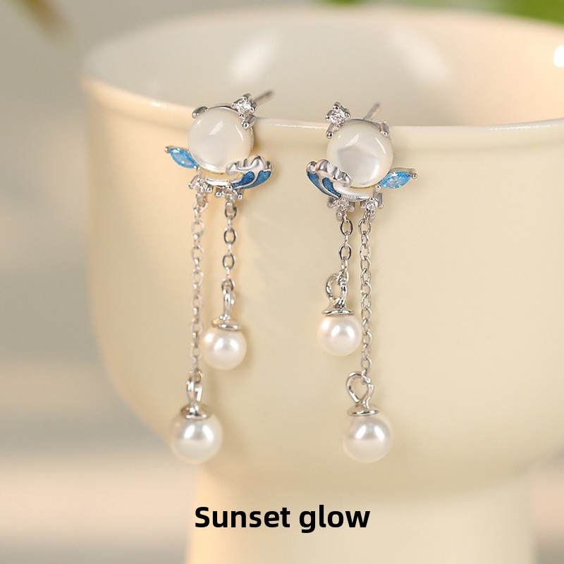 Original sunset-themed earrings for women, made of pure silver, featuring a creative new Chinese design with pearl tassels and wave-shaped embellishments