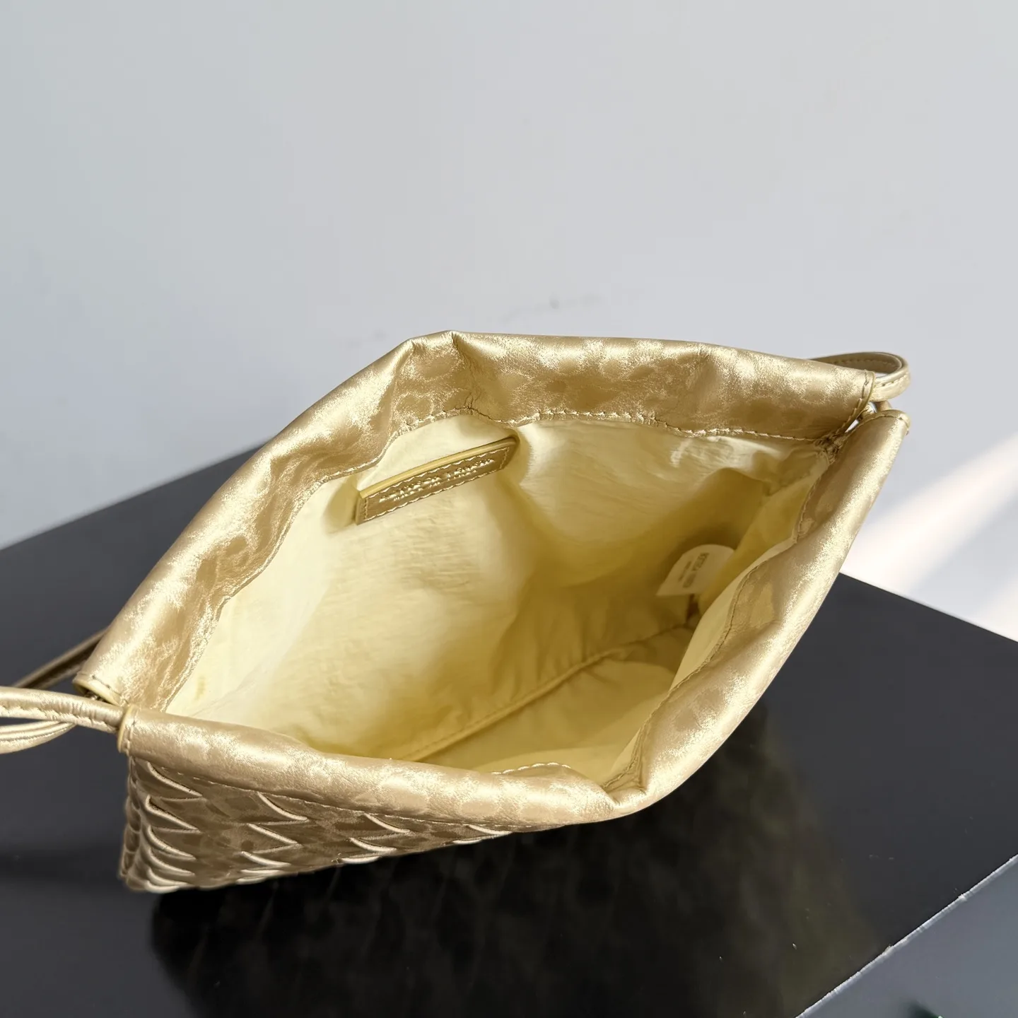 Bottega Veneta Dustbag Intrecciato Woven Leather Bucket Bag product photo from LabelPicks