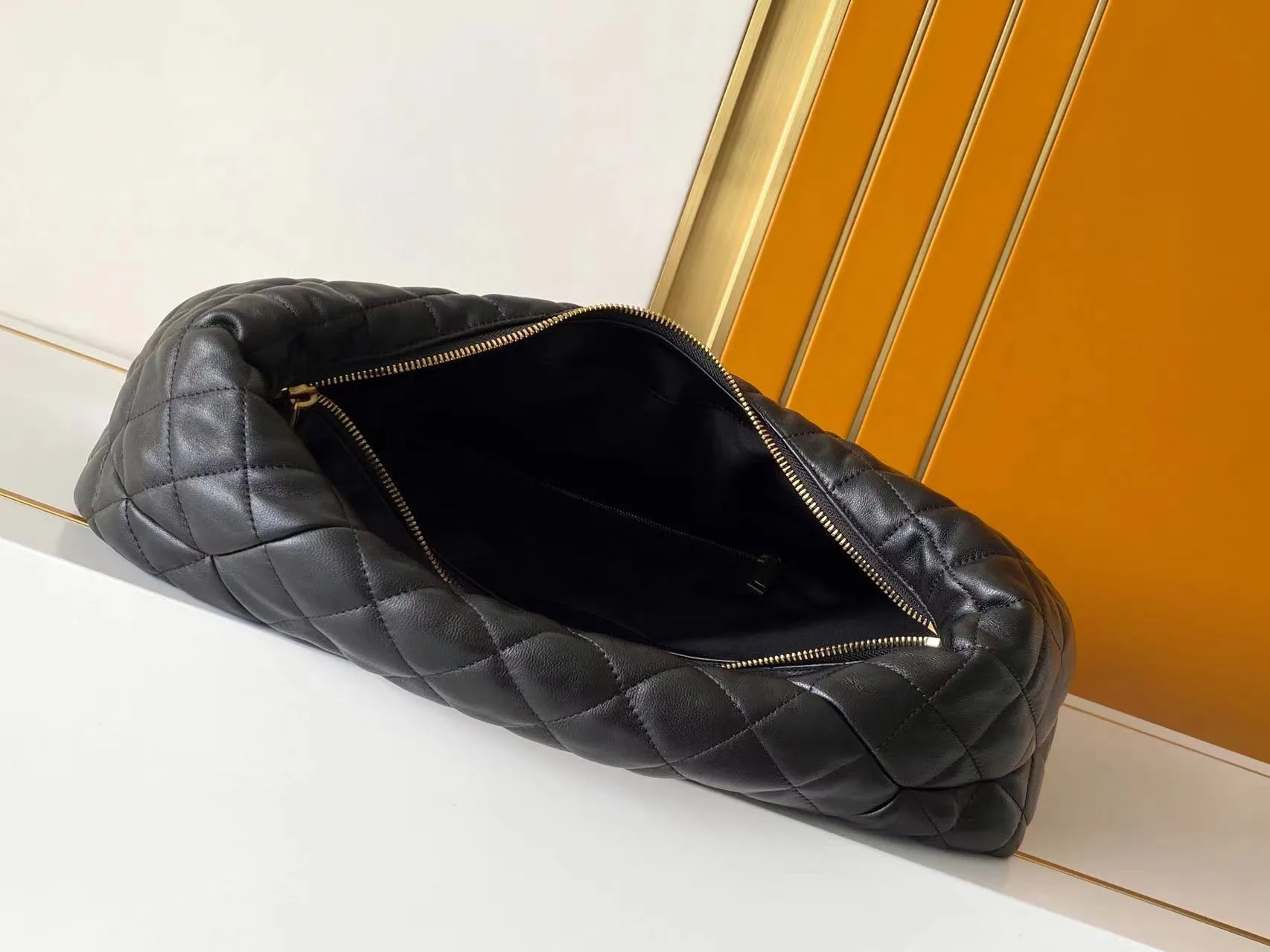 Saint Laurent Lambskin Icare Hobo Bag product photo from LabelPicks