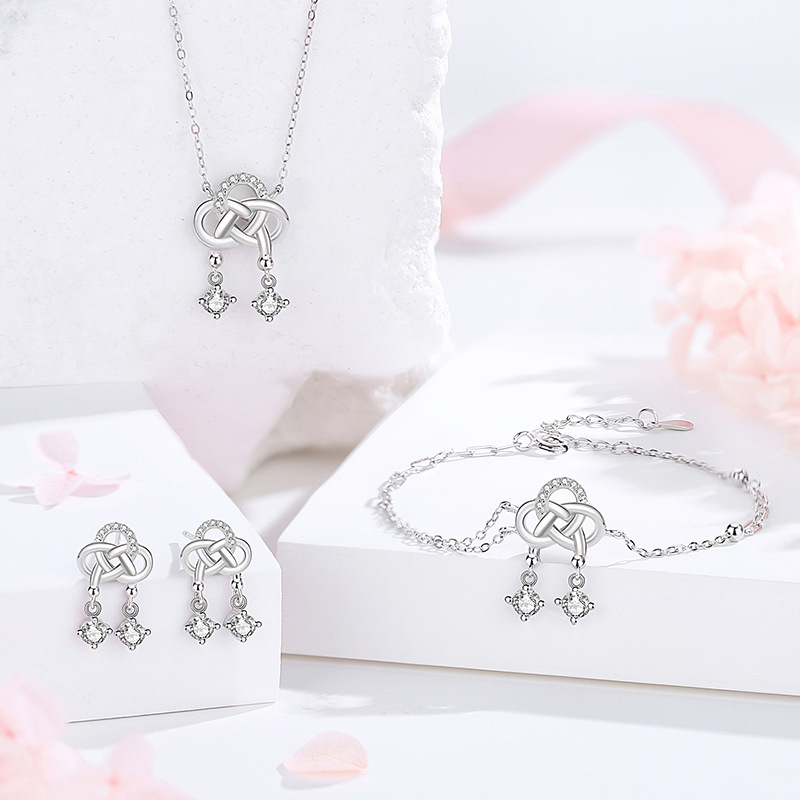 Original Chinese knot earrings for women, made of pure silver, featuring a new Chinese style, retro design, high-end quality, and versatile appeal, with delicate inlaid details and twisted elements