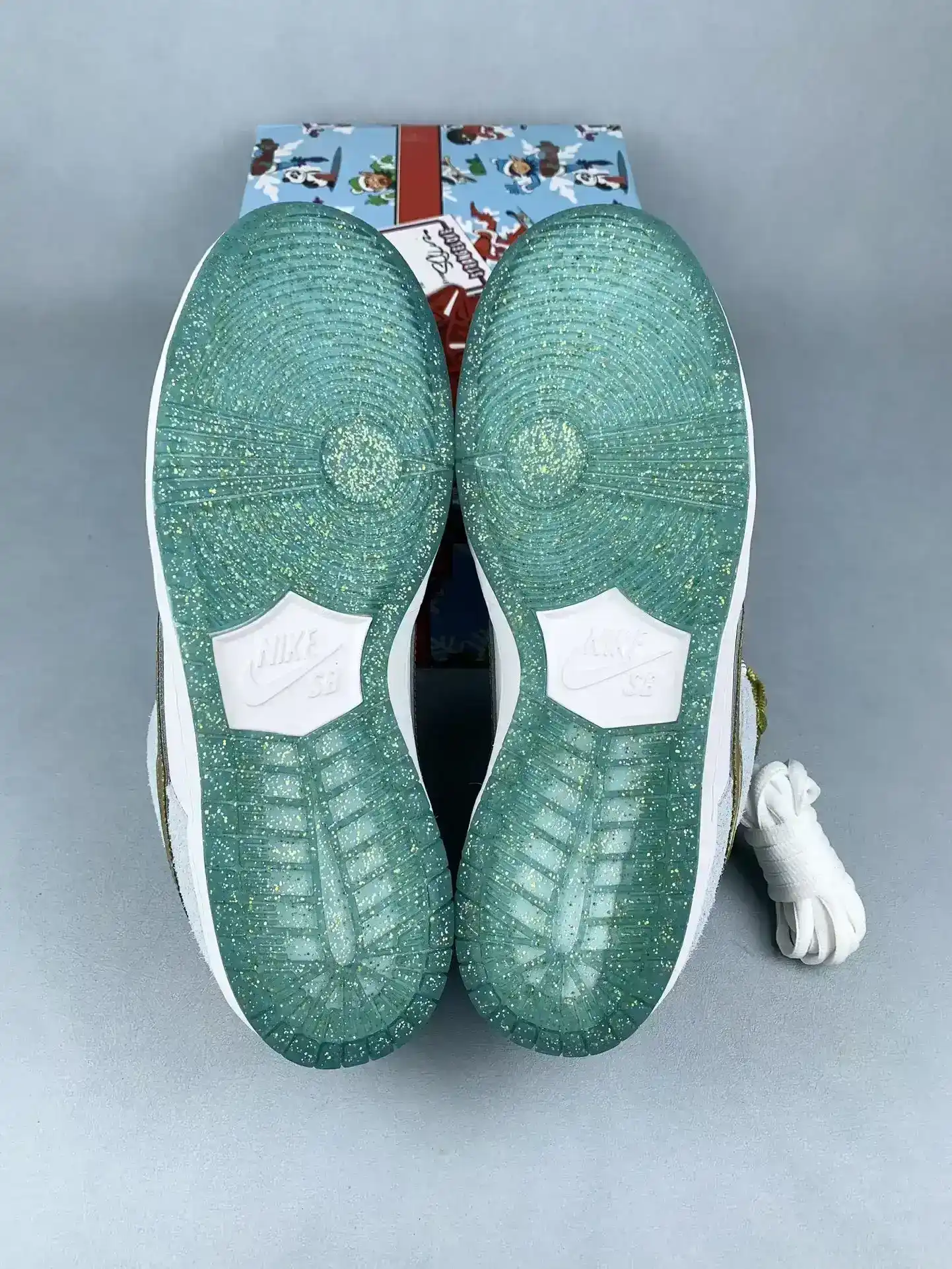 Sean Cliver x Nike SB Dunk Low Pro QS “Holiday Special” - White/Psychic Blue/Metallic Gold product photo from LabelPicks