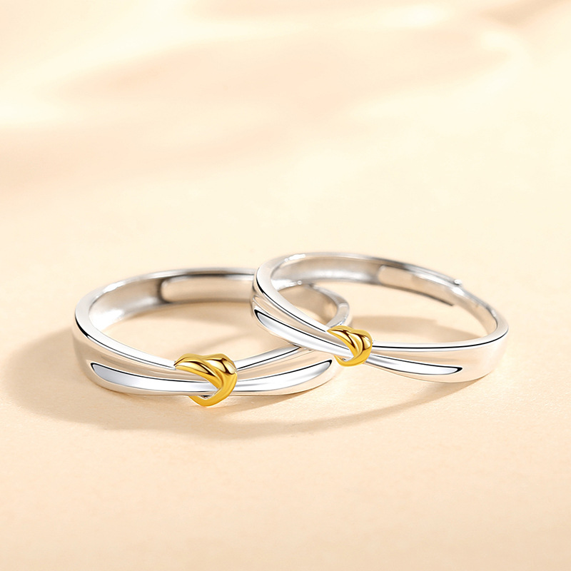Matching couple rings, a pair of sterling silver rings with a unique design featuring a double V and a heart, a creative and stylish ring for couples