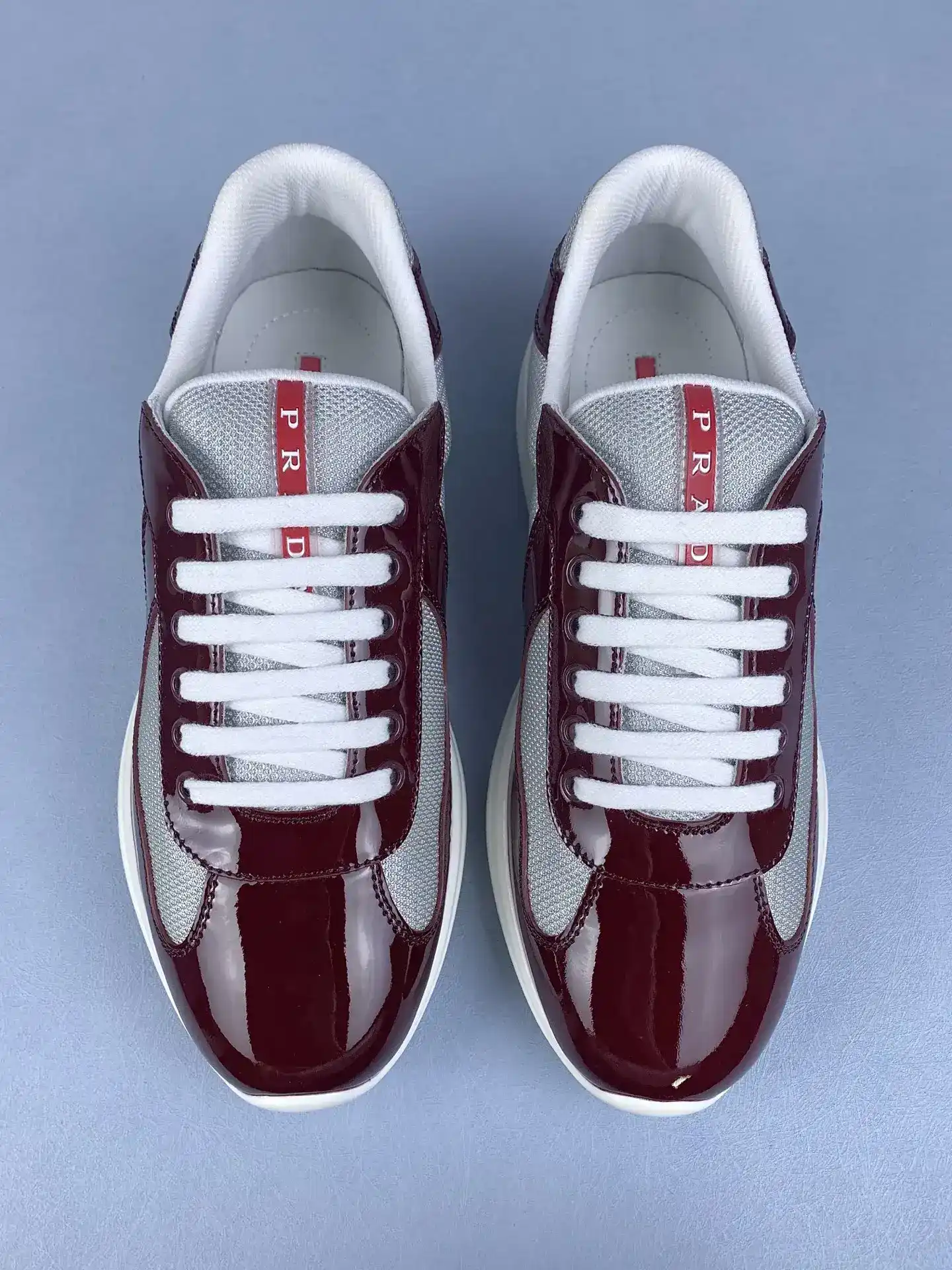 Patent leather and technical fabric Prada America's Cup sneakers product photo from LabelPicks