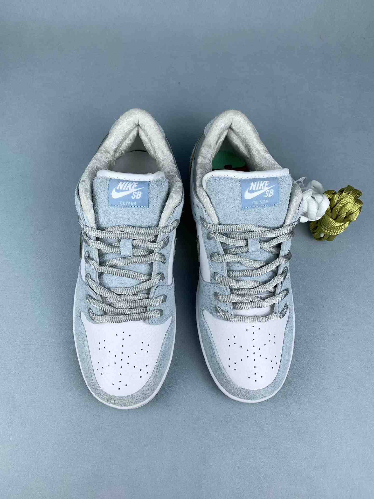 Sean Cliver x Nike SB Dunk Low Pro QS “Holiday Special” - White/Psychic Blue/Metallic Gold