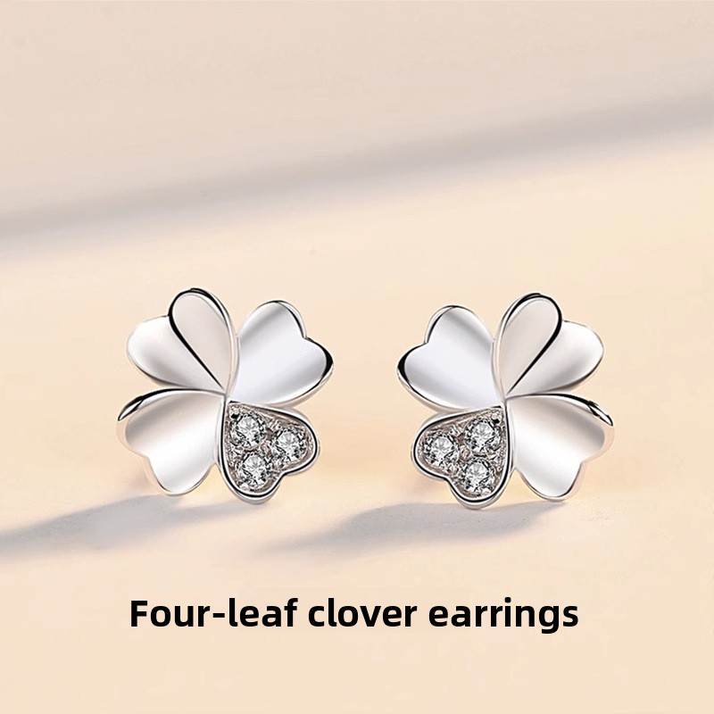 Four-leaf clover earrings, made of 999 pure silver, Korean style, minimalist design, forest-themed, heart-shaped, trendy geometric leaf design, Instagram-style earrings