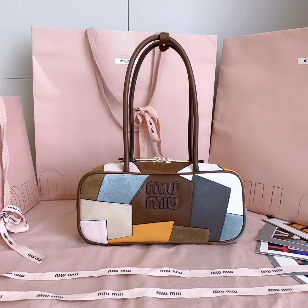 Miu Miu Canvas and Leather Top Handle Bag product photo from LabelPicks
