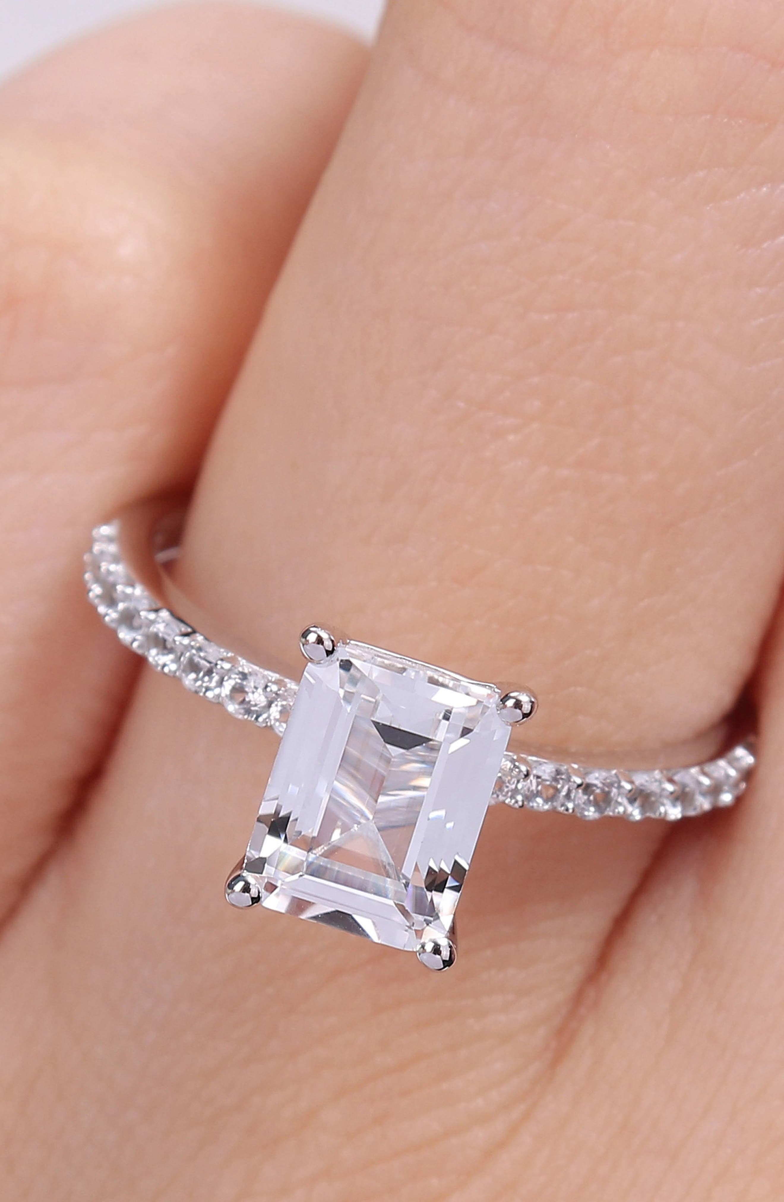 DELMAR 10K White Gold Plated Sterling Silver Emerald Cut Created White Sapphire Ring
