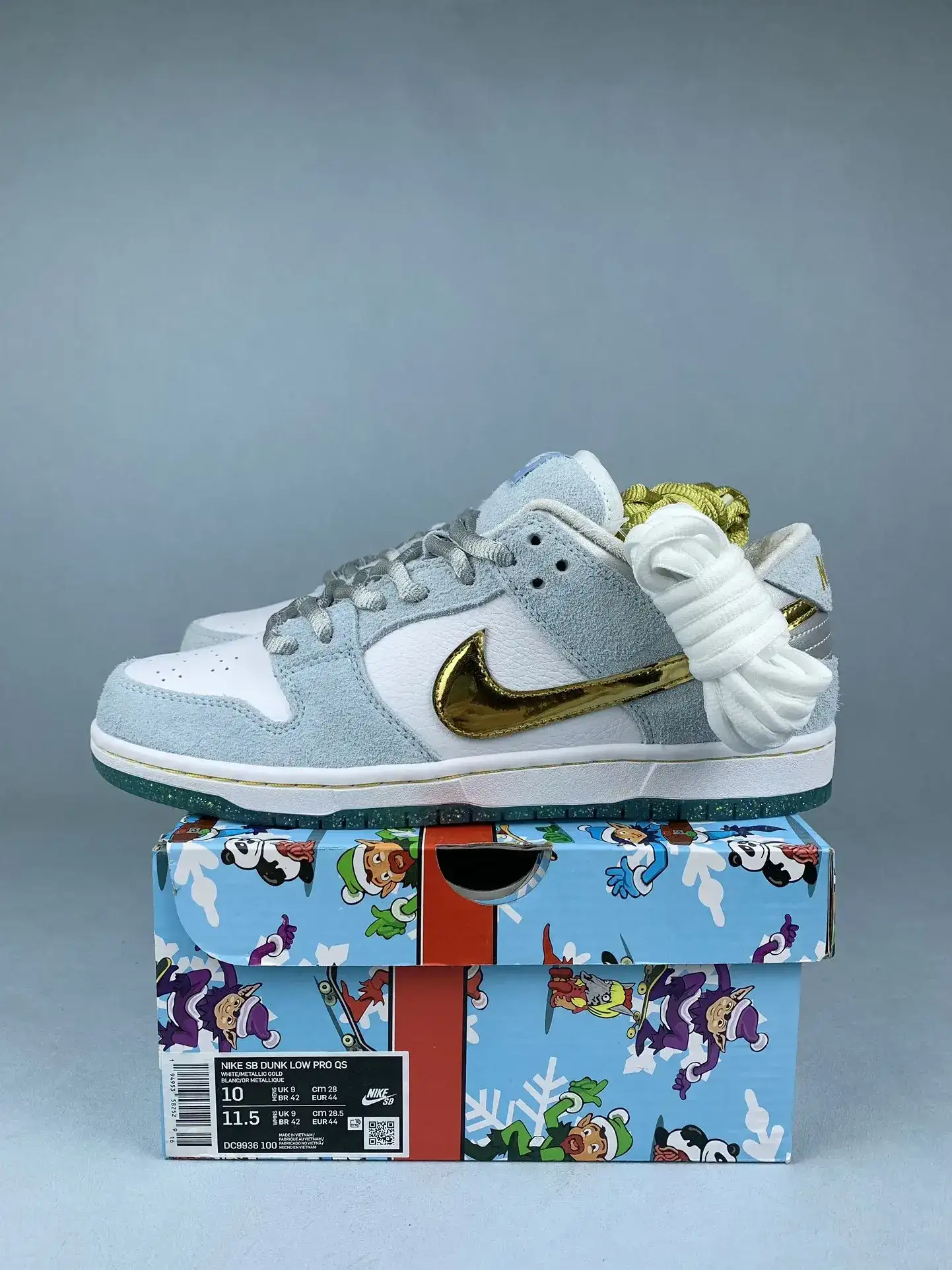Sean Cliver x Nike SB Dunk Low Pro QS “Holiday Special” - White/Psychic Blue/Metallic Gold product photo from LabelPicks