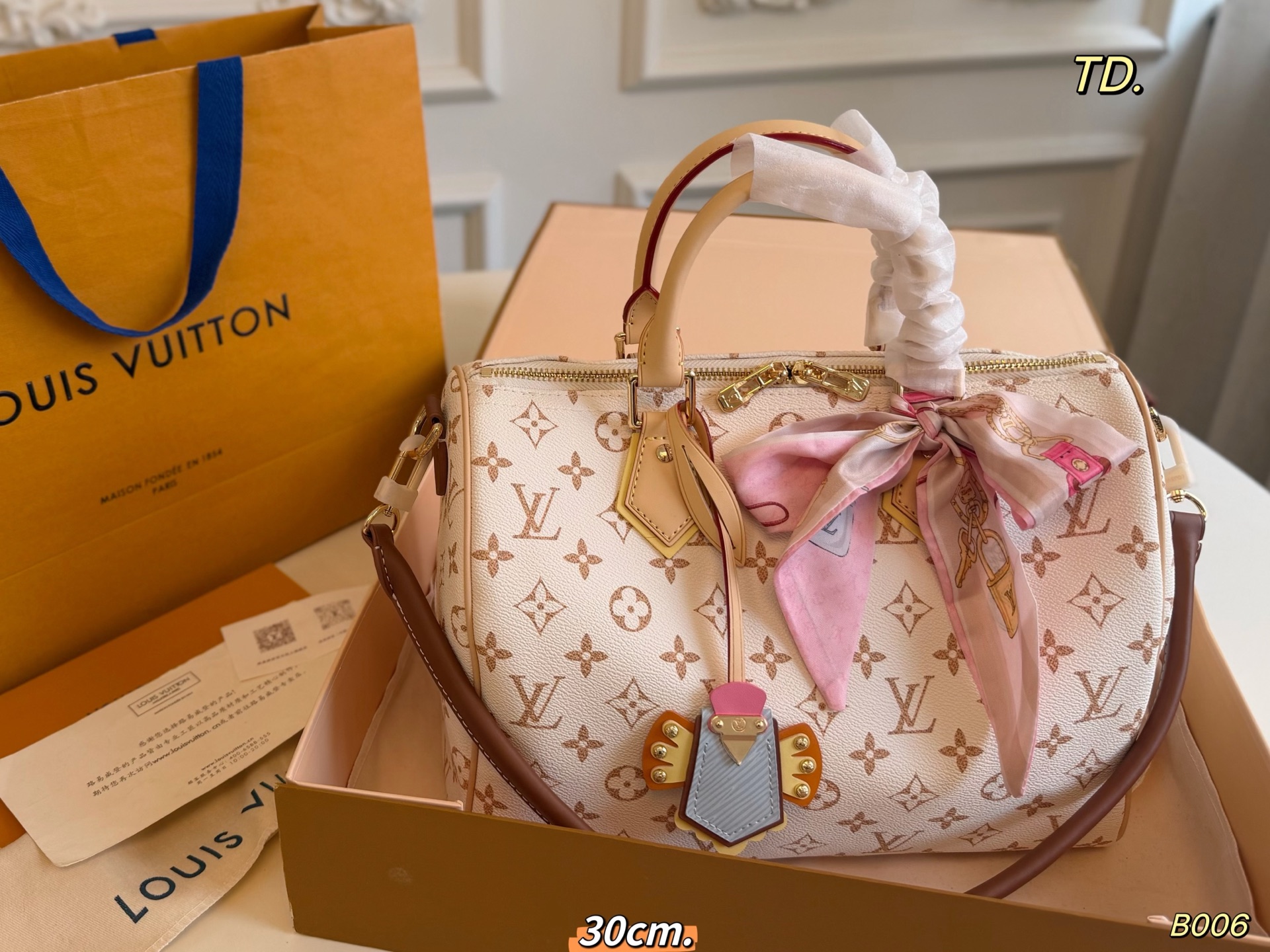 LV Dune-colored Speedy Boston bag