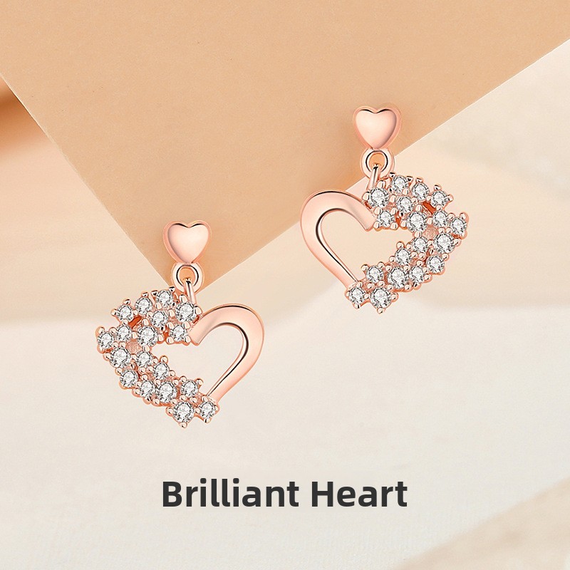 Sparkling heart-shaped earrings for women, made of pure silver, fashionable and versatile, with a delicate and elegant design, featuring cubic zirconia stones