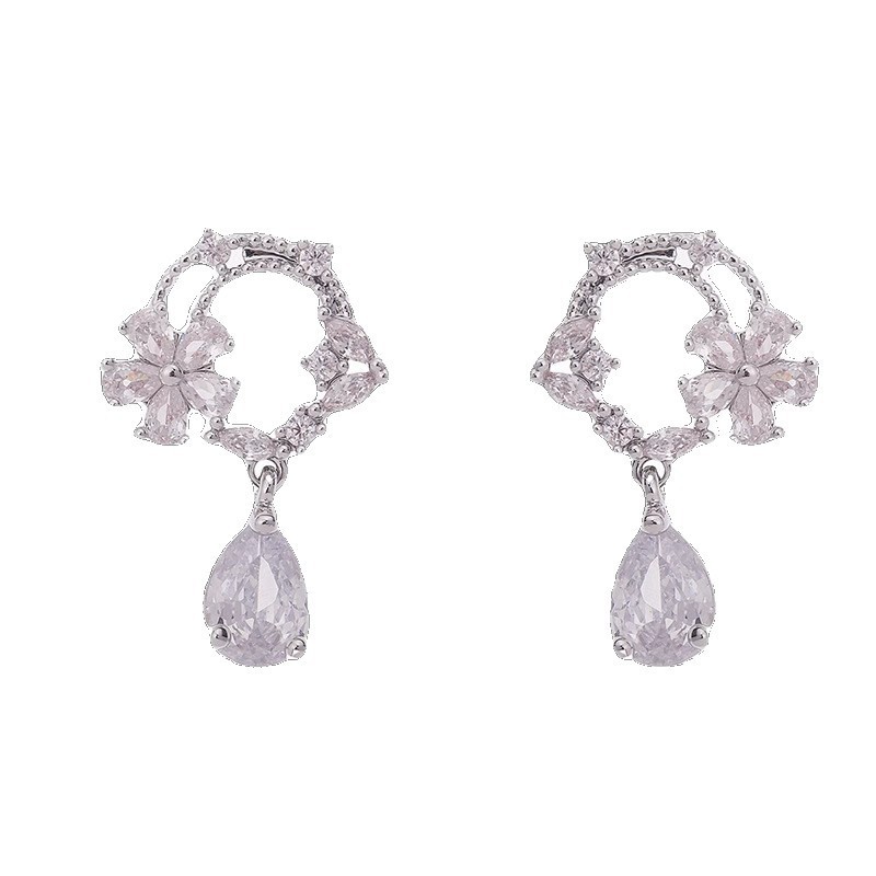 S925 sterling silver moonlit tea brewing earrings, featuring a hollow design, a cubic zirconia flower ring, and a delicate, stylish, and unique look
