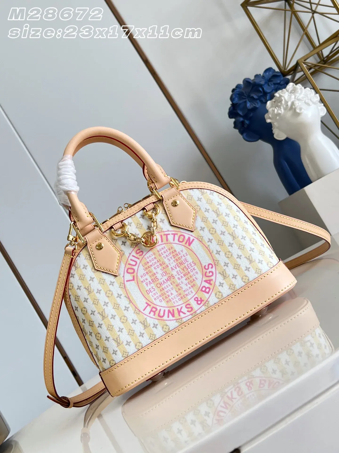 Louis Vuitton Alma Gold Canvas and Leather Top Handle Bag product photo from LabelPicks