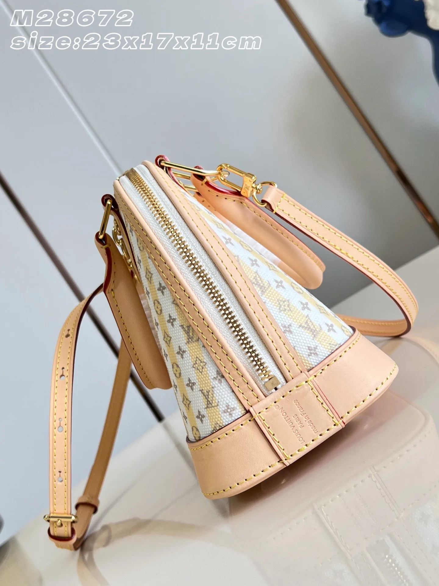 Louis Vuitton Alma Gold Canvas and Leather Top Handle Bag product photo from LabelPicks