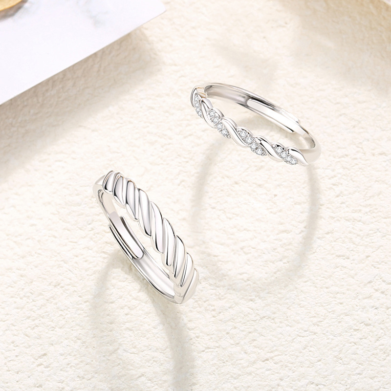 s925 sterling silver, a pair of rings with a romantic and intertwined design, featuring a unique twist pattern, exuding a sophisticated and trendy aesthetic
